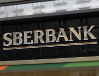 Sberbank - Vysok&eacute; ambice Sberbank rozhodně nechyb&iacute;. Na sn&iacute;mku: logo Sberbank na pobočce
